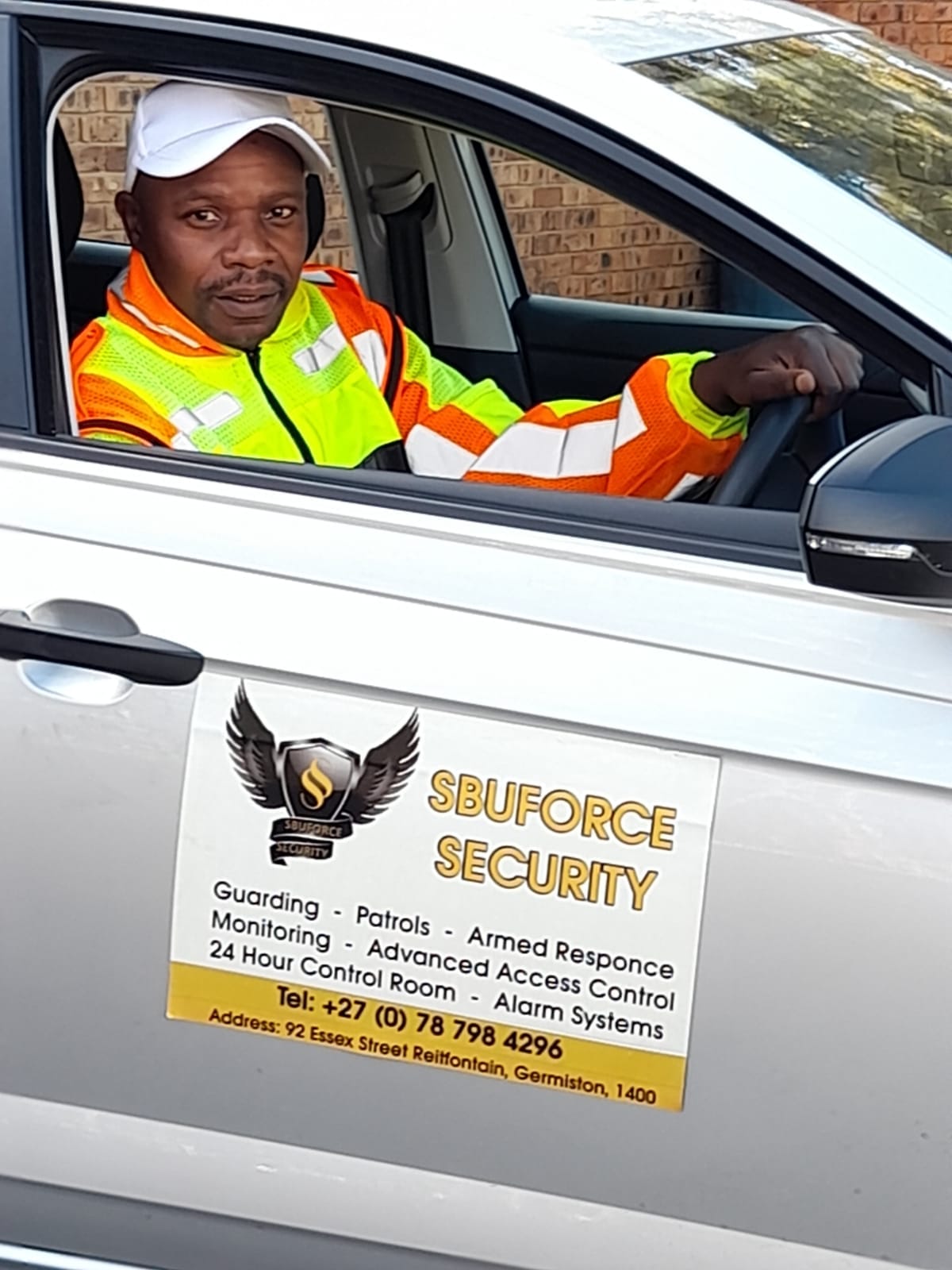 SbuForce Security guard in a marked patrol vehicle